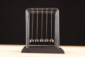 Newton cradle balance balls on the table