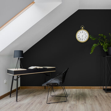 Attic home office room with black wall