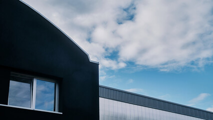 Industrial warehouse under a nice blue sky.