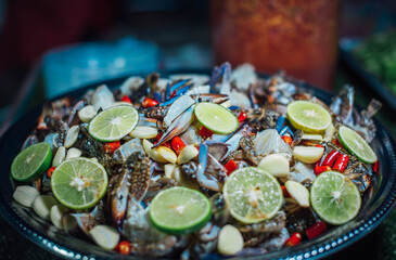Fresh blue crab salad for sale on Walking Street, Chiang Khan District, Thailand.