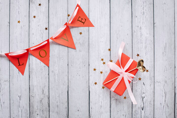 Flat lay romantic photography with paper origami heart on natural background. Cute romantic greeting card template.