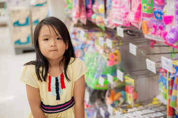 Asian girls shop for toys at department stores