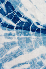 The fabric indigo tie dye as a background and texture.