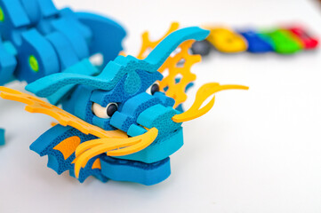 Plastic dragon toy. Dukor to celebrate Chinese New Year