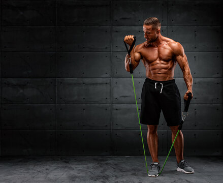 Muscular Men Training With Resistance Bands