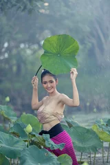 Foto op Plexiglas Asian woman harvest lotus flower in the garden, © warongdech