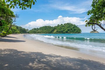 Manuel Antonio beatiful tropical beach with white sand and blue ocean. Paradise. National Park in...