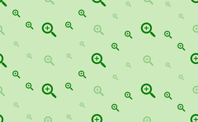 Seamless pattern of large and small green zoom in symbols. The elements are arranged in a wavy. Vector illustration on light green background