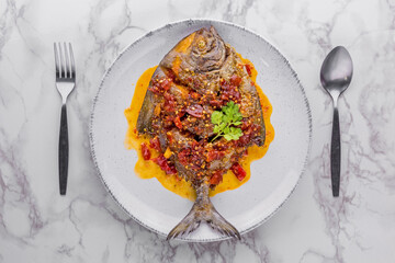 Deep fried pomfret fish and chili sauce