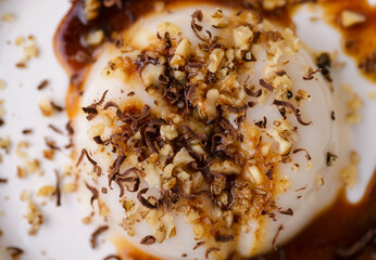 panna cotta with sauce and nuts