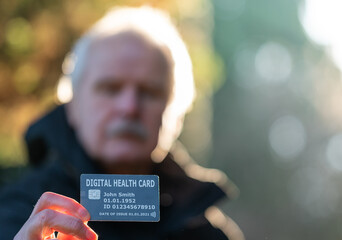 Senior citizen showing a digital health card.