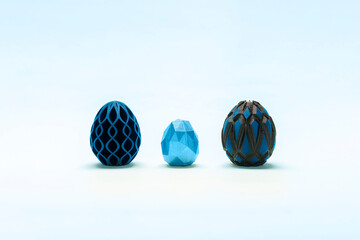Trendy Easter low poly decor. Blue and black eggs of geometric style. Happy Easter greeting card. Holiday concept in minimal style.