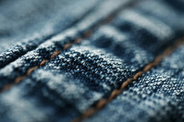 Jeans denim texture close up , focus only one point , soft blured background wallpaper
