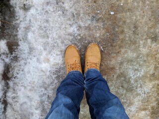first person view man tilts his head looking for boots