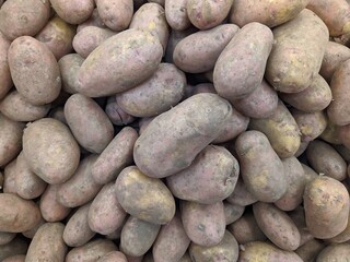 lot of potatoes in the market closeup photo