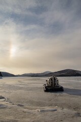 Fototapeta na wymiar hovercraft on the frozen lake 