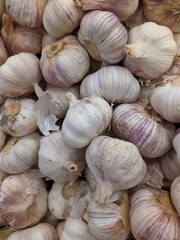 lot of garlic in the market closeup photo
