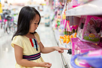 Asian girls shop for toys at department stores