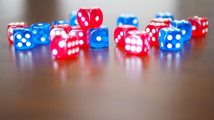 blue and red dices game on wooden table top selected focus