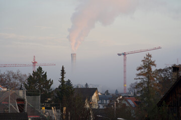 Fototapeta na wymiar Smoke from the chimney at city of Zurich, Switzerland.