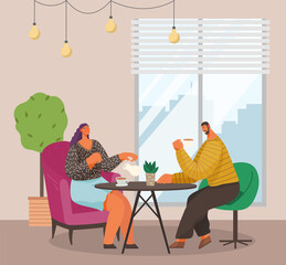 Man and woman sitting at the table with coffee in restaurant. Married couple drink tea in the kitchen at home, sitting at a cozy table with a bouquet in a vase. Friends, colleagues, business meeting