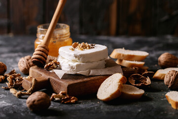 Goat cheese served with honey and walnuts