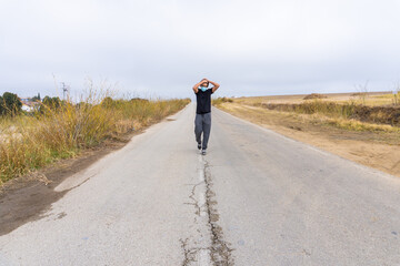 Obraz premium Young Boy Walking in Road