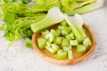 Fresh celery stalks cut into pieces for cooking