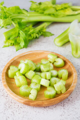 Fresh celery stalks cut into pieces for cooking