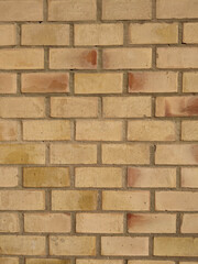 Ibiza, Spain - January 14, 2021: Yellow brick wall. Texture, material, surface, background.