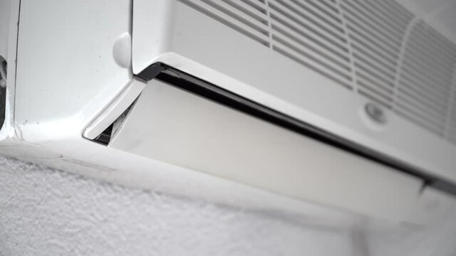 Air conditioner with open horizontal jalousies in room