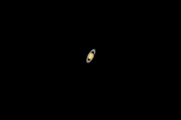 Planet Saturn and its rings as seen from an advanced amateur telescope from a city sky at Santiago...