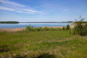 Panorama of renaturized brown coal open pit landscape with the lake Grosser Goitzschesee near the town of Bitterfeld, Germany, Europe