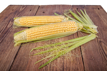 Corn on the cob on a wooden background. View from another angle in the portfolio.