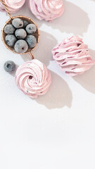 Handmade marshmallow with blueberries, white background. Violet Marshmallow, Meringue, Zephyr