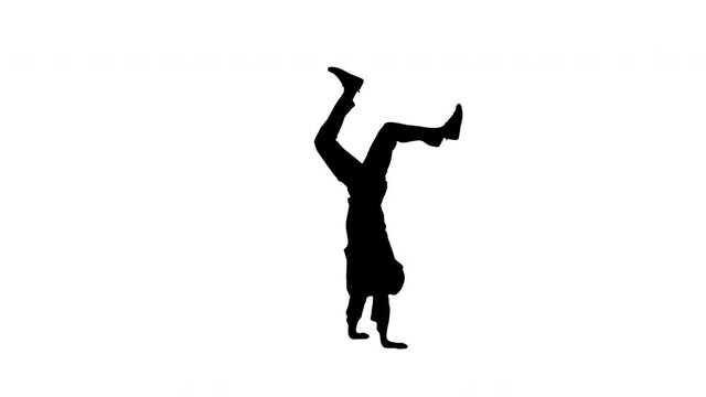 Silhouette Male doctor in white robe and protective cap dancing breakdance on his head and arms.