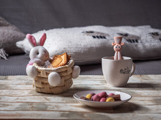 Easter basket with a hare and cookies and a talelochka with chocolate eggs