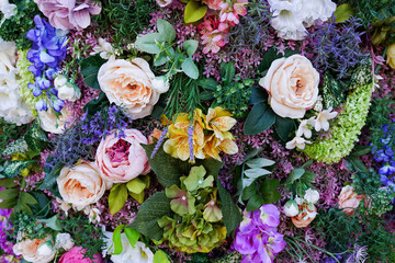 Creative layout made of flowers and leaves. Flat lay. Nature concept