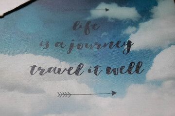 Text on cloudy sky life is a journey travel it well