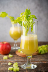 Fototapeta premium Fresh juice apple and celery in a clear glass, vegetarian food, clean food