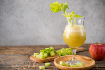 Fresh juice apple and celery in a clear glass, vegetarian food, clean food