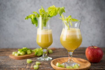 Fresh juice apple and celery in a clear glass, vegetarian food, clean food