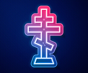 Glowing neon line Christian cross icon isolated on blue background. Church cross. Vector.