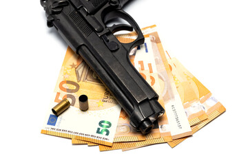 Gun pistol and money euros on white background. 
