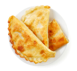 Fried cheburek on a plate on a white background, isolated. Top view