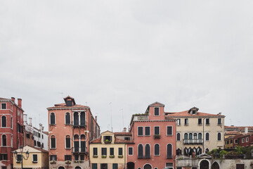 Fototapeta na wymiar Houses under cloudy sky in Venice, Italy