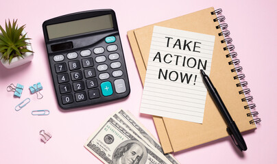 Take action Now words on notebook closeup