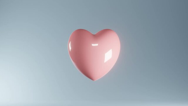 Pink glossy plastic heart pulsating on light blue background. 3D rendering valentines day looping motion animation.
