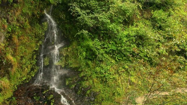 Small waterfall in Himalayan mountains in Nepal