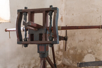 Scorpion Throwing Catapult. An old siege catapult stands in an old hangar